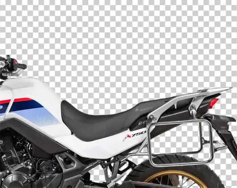 A rear-quarter view of a white, blue, and red Honda XL750 Transalp motorcycle with side luggage racks.
