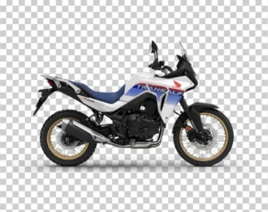 A side view of a white, blue, and red Honda XL750 Transalp adventure motorcycle.