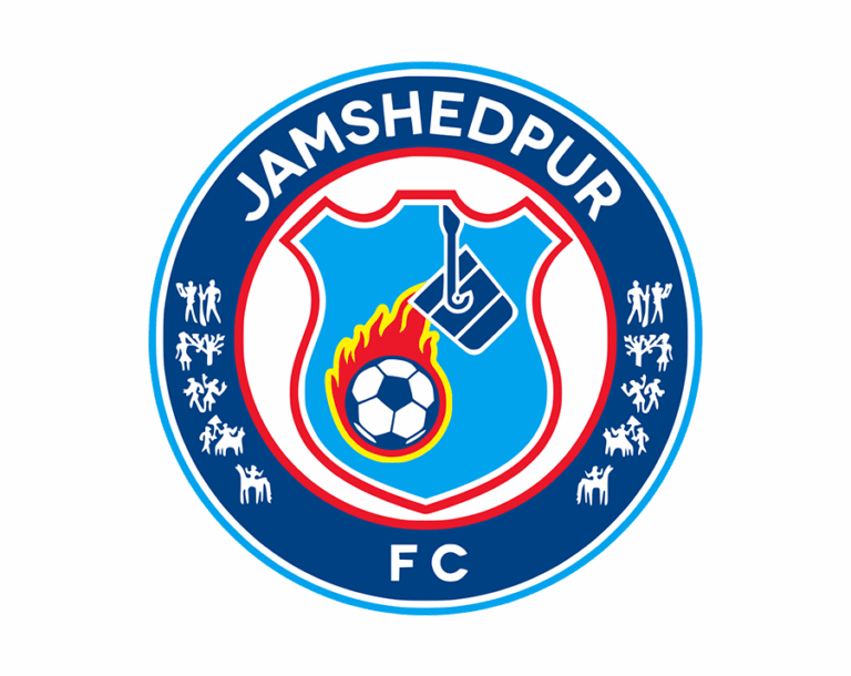 The Jamshedpur FC logo, a bright blue shield with a red border inside a dark blue circle, featuring a flaming football and an overhead ladle (pot), symbolizing the city's steel heritage.