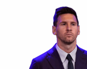 Lionel Messi in a dark suit and tie, looking serious, with a neutral background. Transparent PNG.