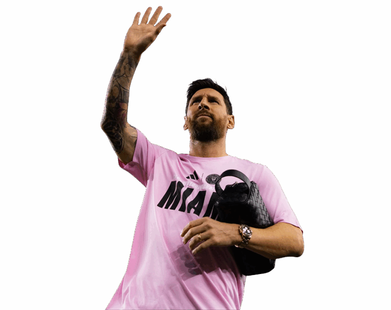 Lionel Messi in a pink Inter Miami logo T-shirt, waving with his tattooed right arm. Transparent PNG.