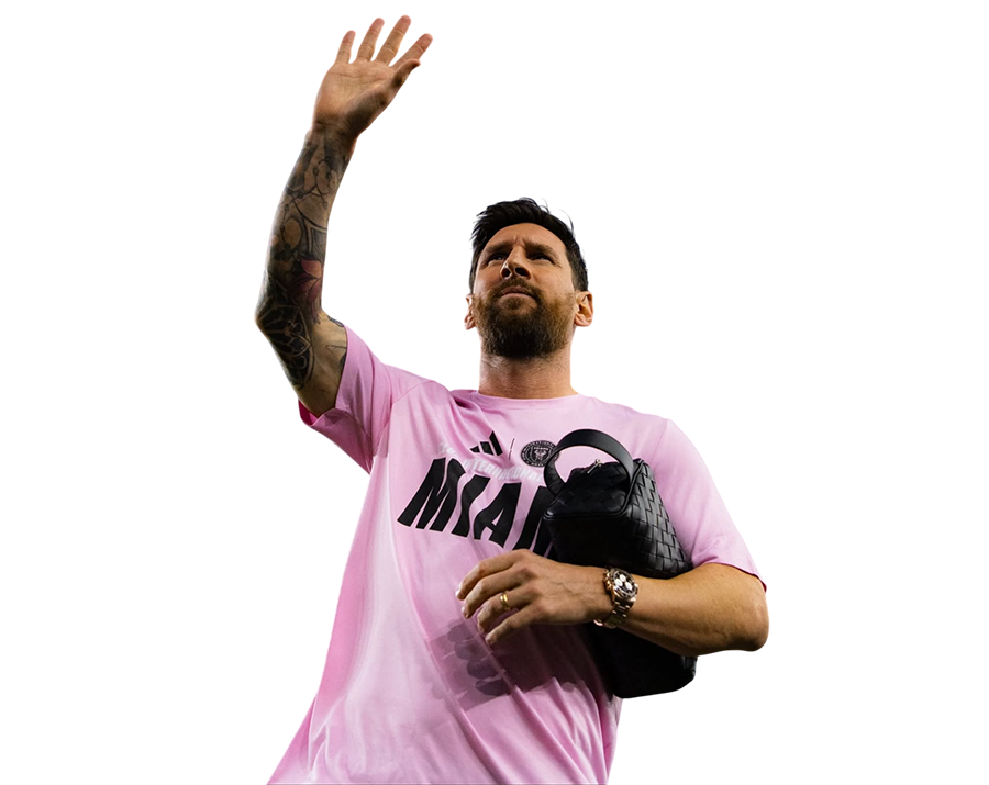 Lionel Messi in a pink Inter Miami logo T-shirt, waving with his tattooed right arm. Transparent PNG.