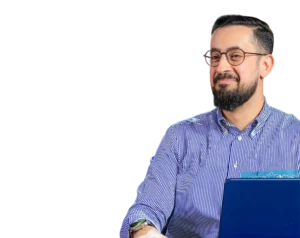 Mehmet Yıldız, a Turkish author and speaker, smiling while working on a laptop. Transparent background.